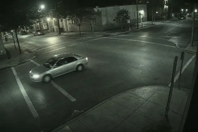 Street corner camera showing vehicle turn captured in searchable video archive