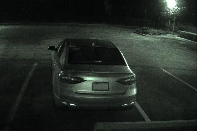 Parking camera capture of vehicle rear license plate for object recognition match